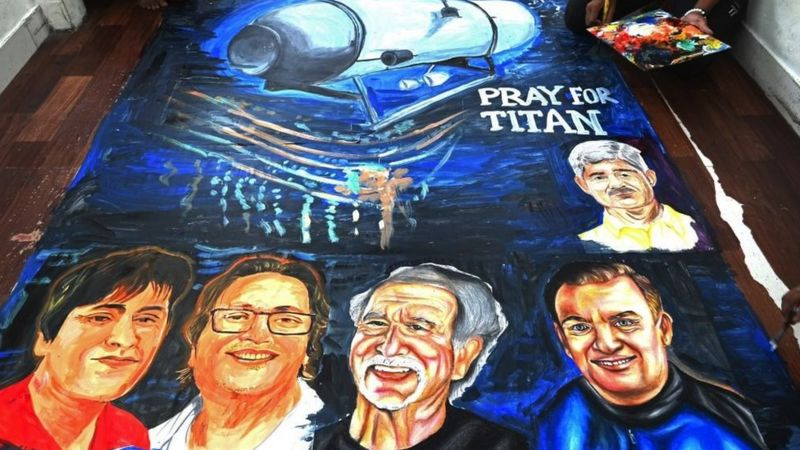 ‘타이탄을 위해 기도합니다’라고 적힌 포스터. 실종된 타이탄에 탑승했던 승객 5명의 얼굴도 함께 그렸다
