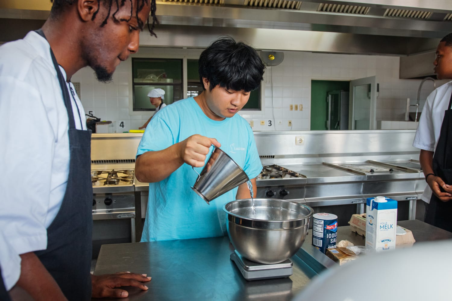 The moment of measuring ingredients together for the bread.