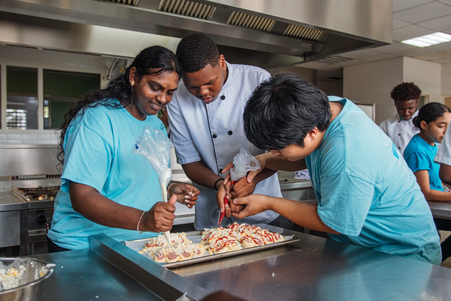 The moment of squeezing ketchup onto the sausage bread.
