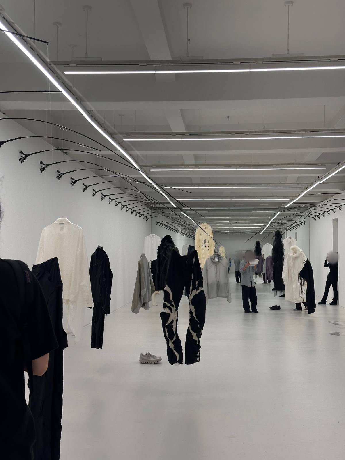 투망 Casting the Net, 2025, Anodized ,aluminum, powder-coated steel, stainless steel, wire, hangers, garments, dimensions variable